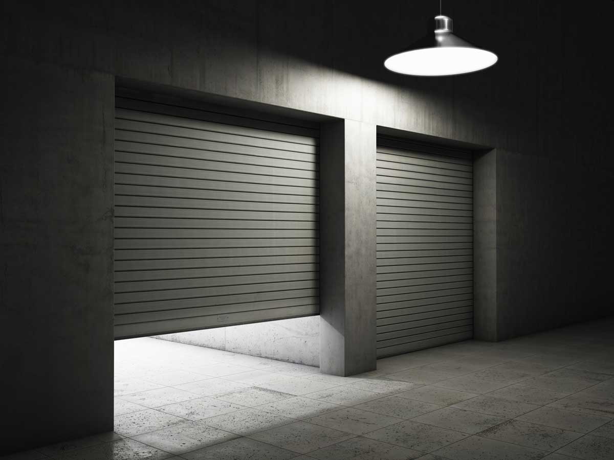 Garage building made of concrete with roller shutter doors